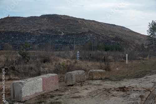 View of the mountain dump with a tractor