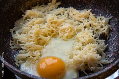 fresh omelet with vermicelli in a pan