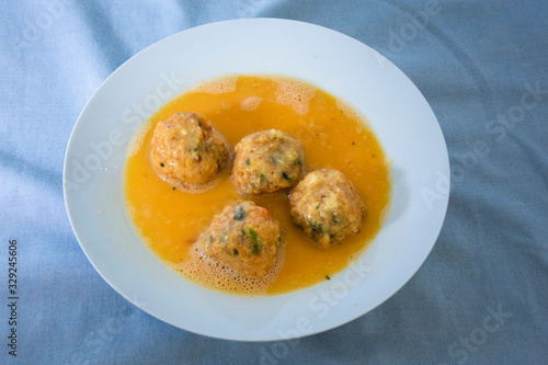 Roll the arancini ball inside the egg