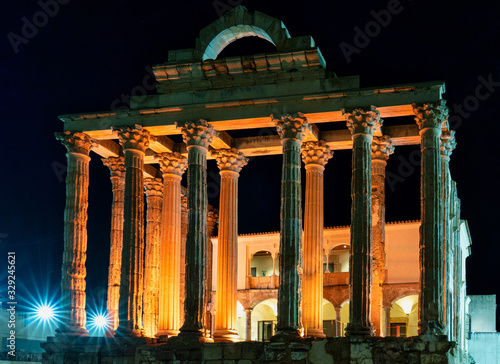 The Roman temple of Diana in Merida, illuminated at night, Extremadura, Spain photo