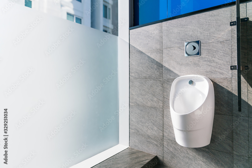 Sanitation white ceramic urinal in the men's bathroom with hygienic ...