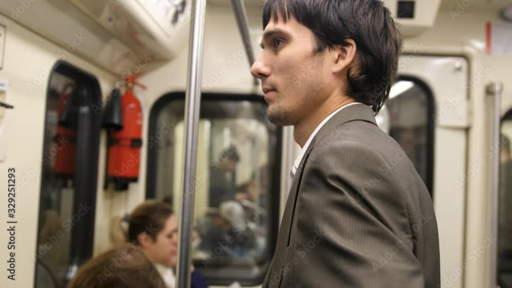 Businessman using smartphone in a subway Businessman using smartphone in a subway