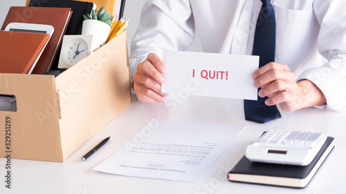 Businessman holding with I quit words card letter, resign employee Change of job concept.
