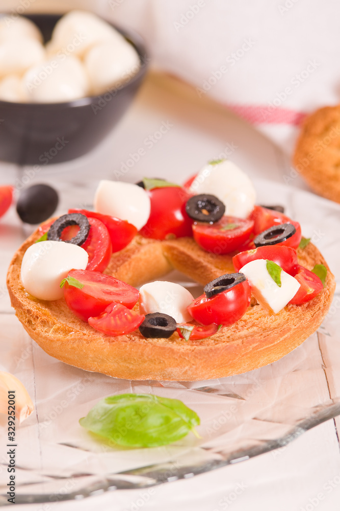 Friselle with tomatoes and mozzarella cheese. Friselle with tomatoes and mozzarella cheese.