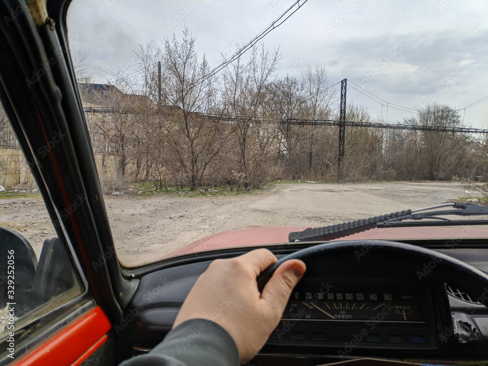 driving a vintage car. the driver is driving. Stock Photo | Adobe Stock