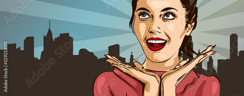 Suprised smiling girl on the urban background.