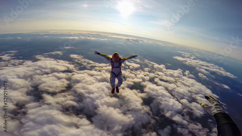Expression. Skydiving makes people confident. Flying in the clouds.