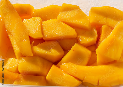 slices of ripe mango as background