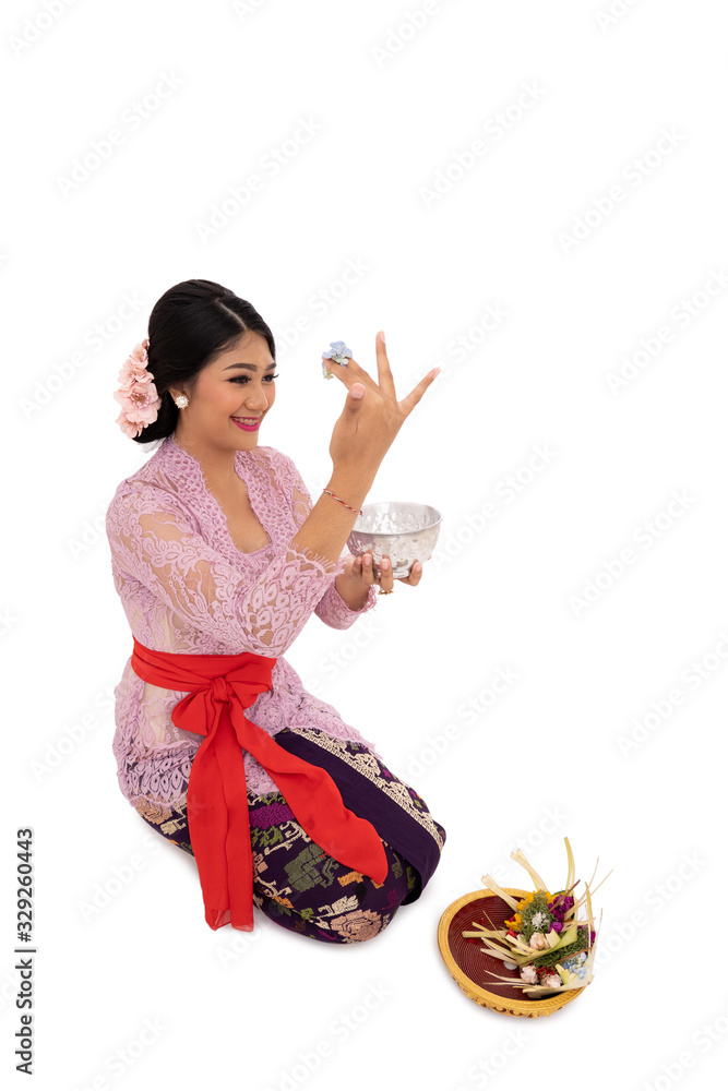 Balinese women wearing traditional clothes when pray according to Hinduism Balinese women wearing traditional clothes when pray according to Hinduism