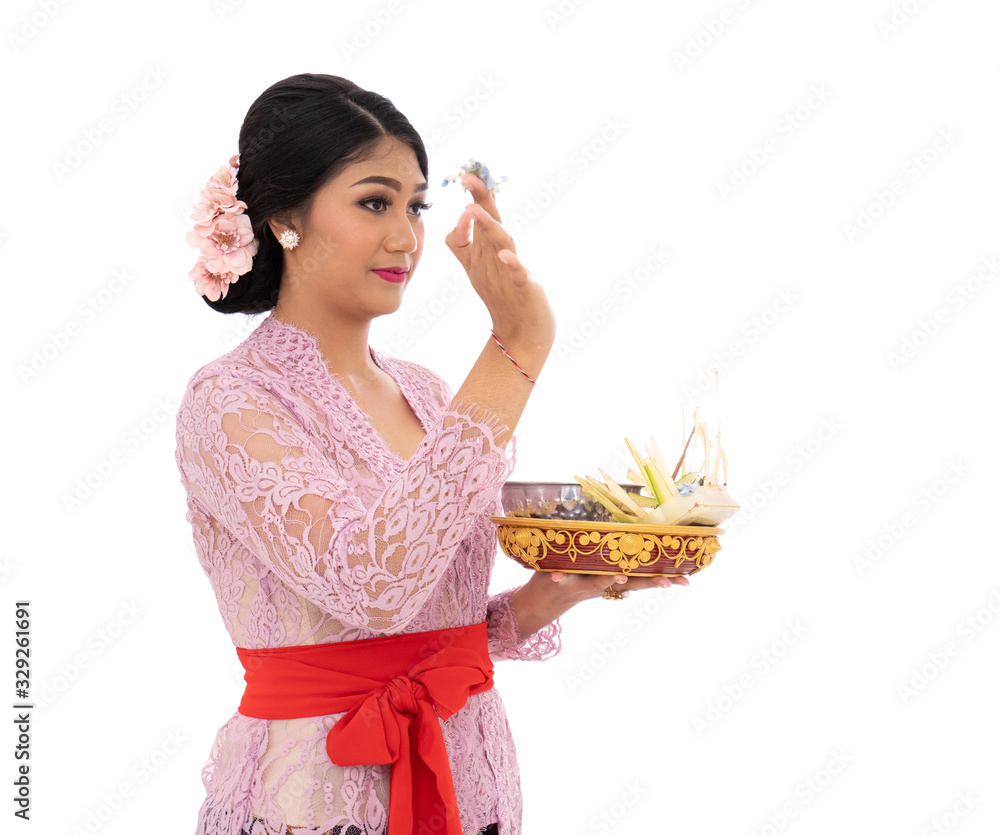 Balinese women wearing traditional clothes when pray according to Hinduism Balinese women wearing traditional clothes when pray according to Hinduism