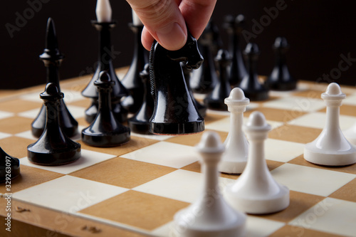 chess pieces on chessboard, checkmate photo dark bg