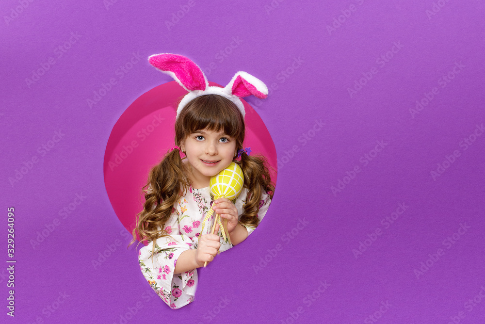 Little girl in a rabbit costume with Easter