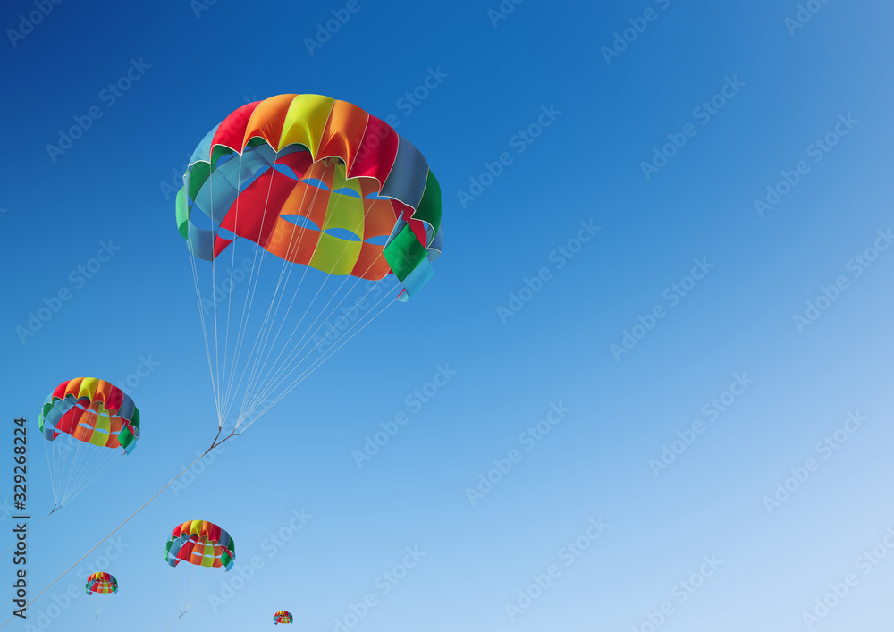Fototapeta premium The colorful parachute stripes on the sky,Summer Camp in Beach