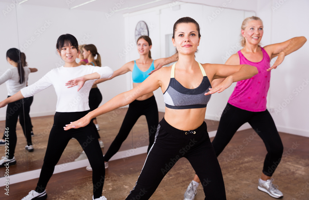 Fitness women practicing zumba movements