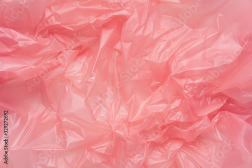Close up Texture of a Pink Plastic garbage Bag. Polyethylene Fil © glazunoff