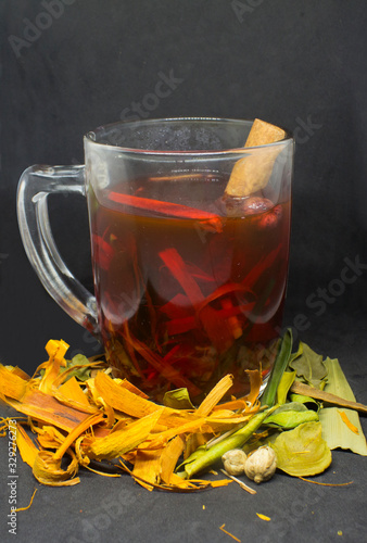 Wedang uwuh, traditional drinks originally from Imogiri, Yogyakarta, Indonesia. Made from spices such as chinnamon, ginger, lime leaves, sappanwood, and lemon grass. photo