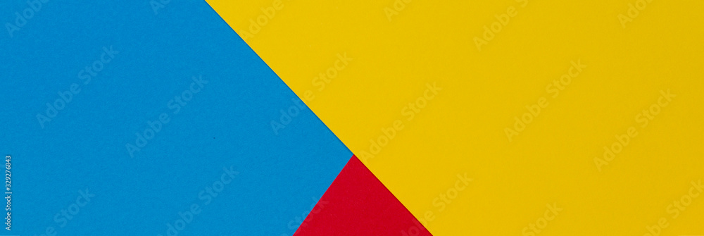 Fototapeta premium Abstract yellow, red and light blue color paper geometry composition banner background