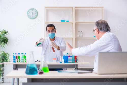 Two chemists working in the lab