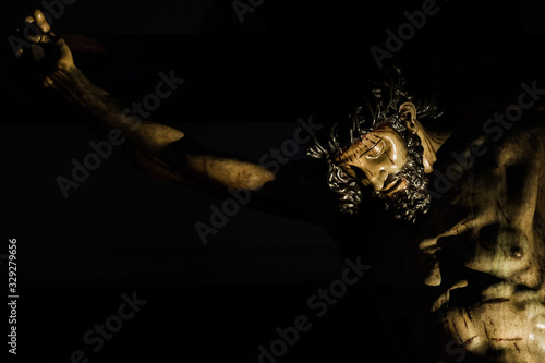  Jesus Christ crucified sculpture isolated on black