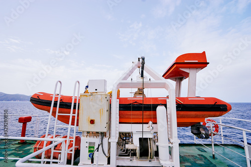 Transportation and safety. Lifeboat on ferry deck.