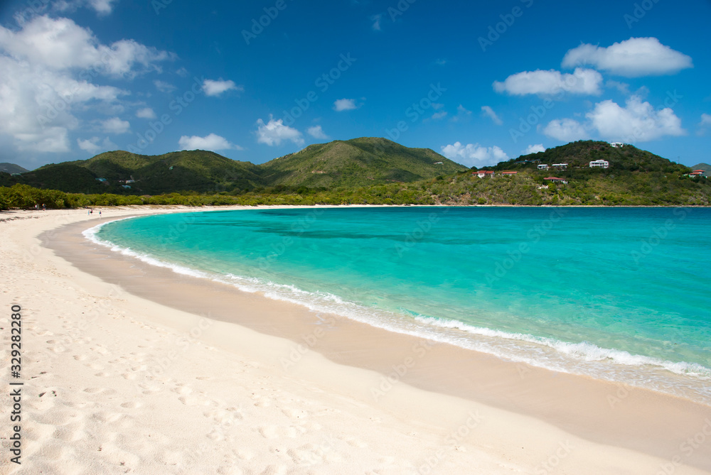 Bright scenic empty view of wide curving Caribbean beach at Long Bay, Beef Island, Tortola, British Virgin Islands