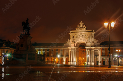 Historical building in Lisbon on Commerce Square, Portugal. Triumphal Rua Augusta Arch. Beautiful night city.
