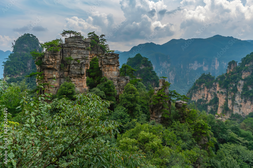 Mountain landscape of surreal rock formations. Pillar, weird column rock formation in in Zhangjiajie National Park, China