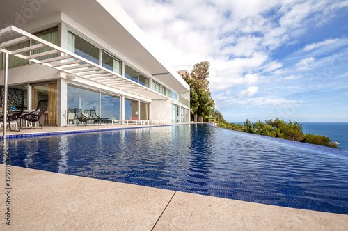 Luxury beach house with sea view. luxury infinity pool and terrace  in modern design, Vacation home for big family. © steftach