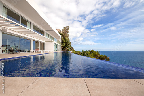 Luxury beach house with sea view. luxury infinity pool and terrace  in modern design, Vacation home for big family. © steftach