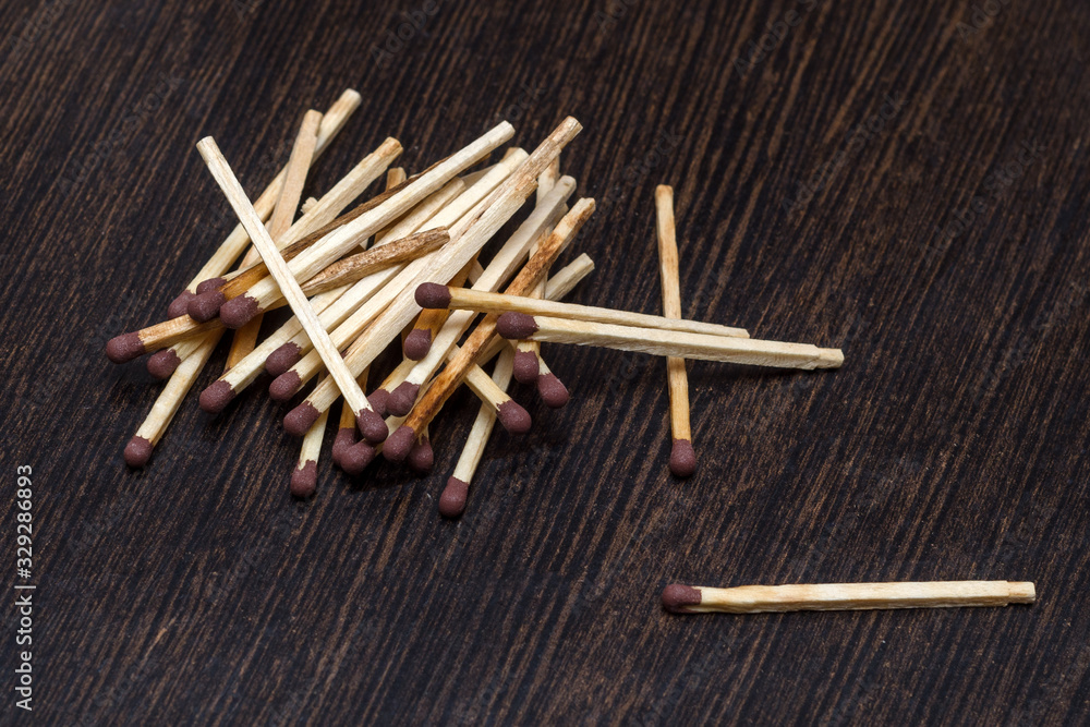 pile of matches on wooden background pile of matches on wooden background