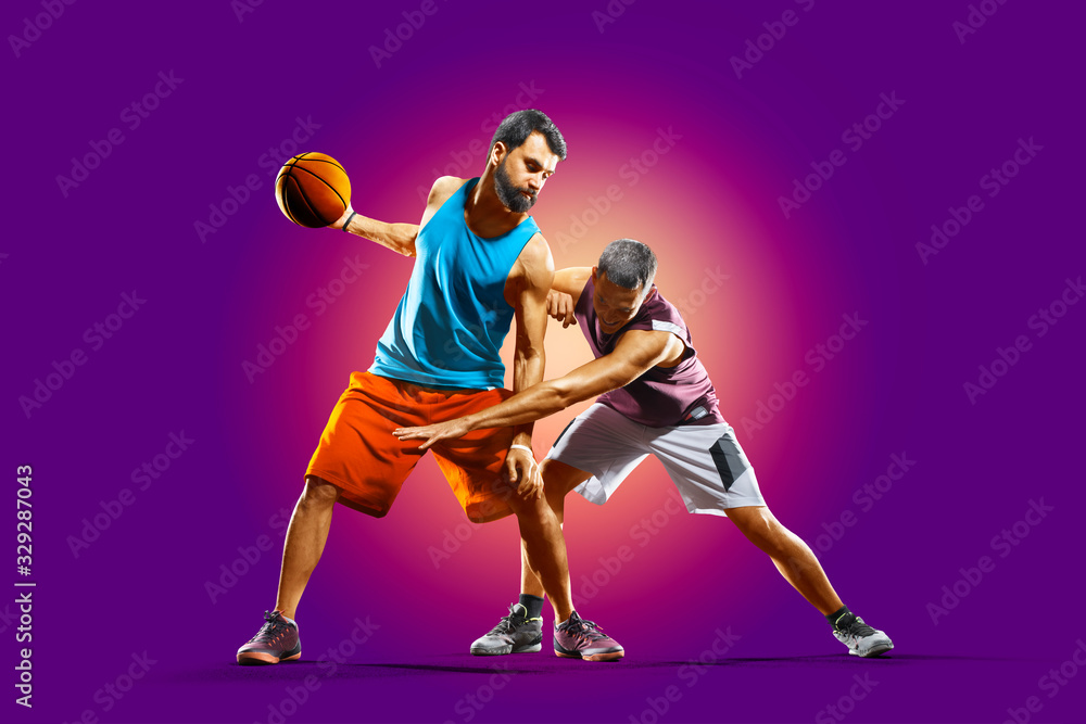 colourful professional basketball players isolated over purple background