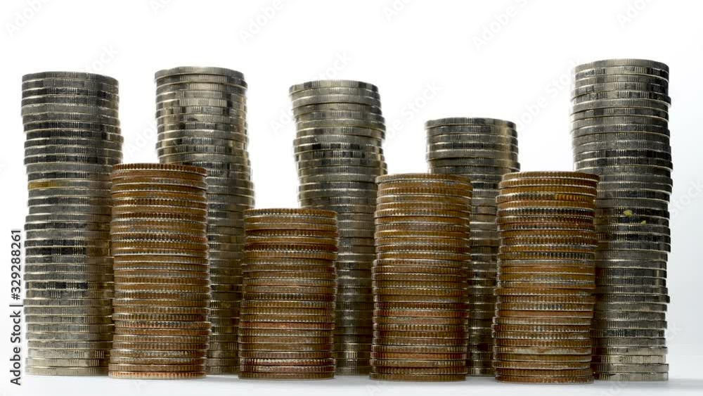 Coins on stack on white background - stop motion . Coins on stack on white background - stop motion .