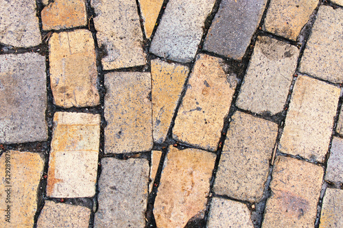 Stone Block Seamless Background. Brick path with different colors stones. Sandstone pavement, crude stone, pebble pavement, wall of stone, cobbled street. gardening outdoor and indoor interiors