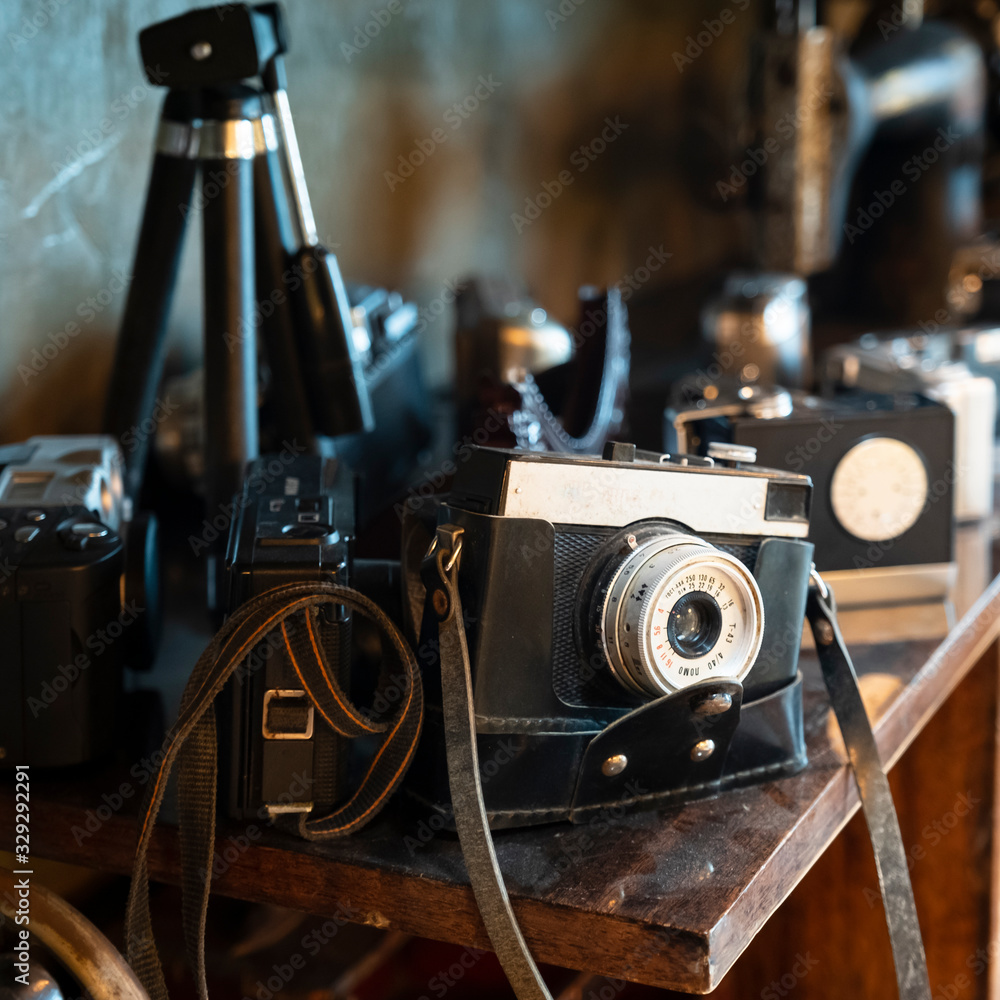 Background where old cameras and antique projectors are utilized in the interior
