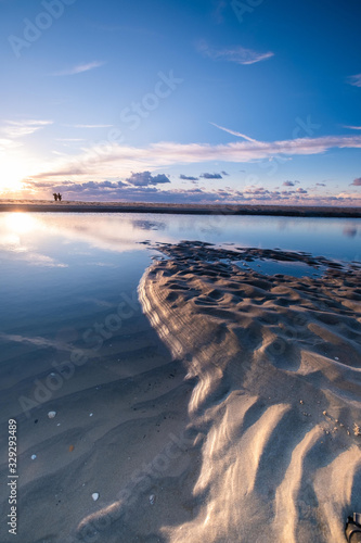 Tranquil colorful sunset over sea  viewed from the dutch coast. The Netherlands