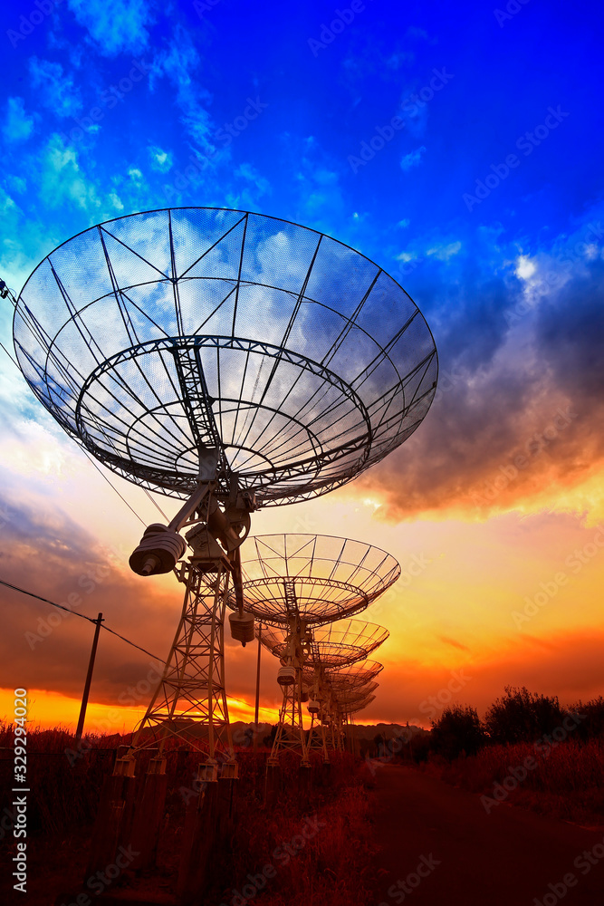 The silhouette of a radio telescope observatory The silhouette of a radio telescope observatory