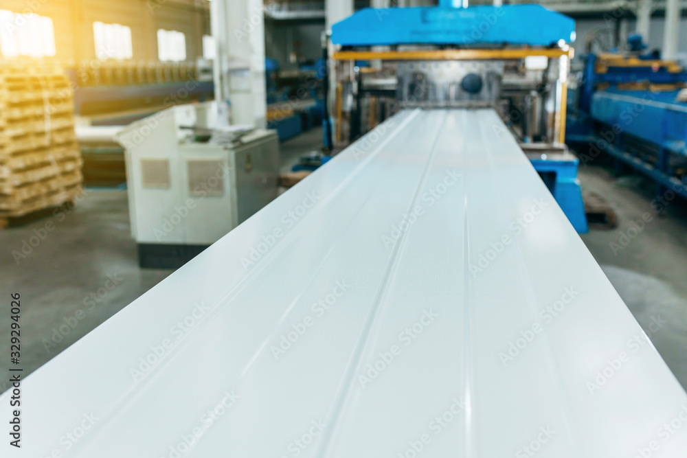 Fotografie Metal sheet roof rolled from rolling machine