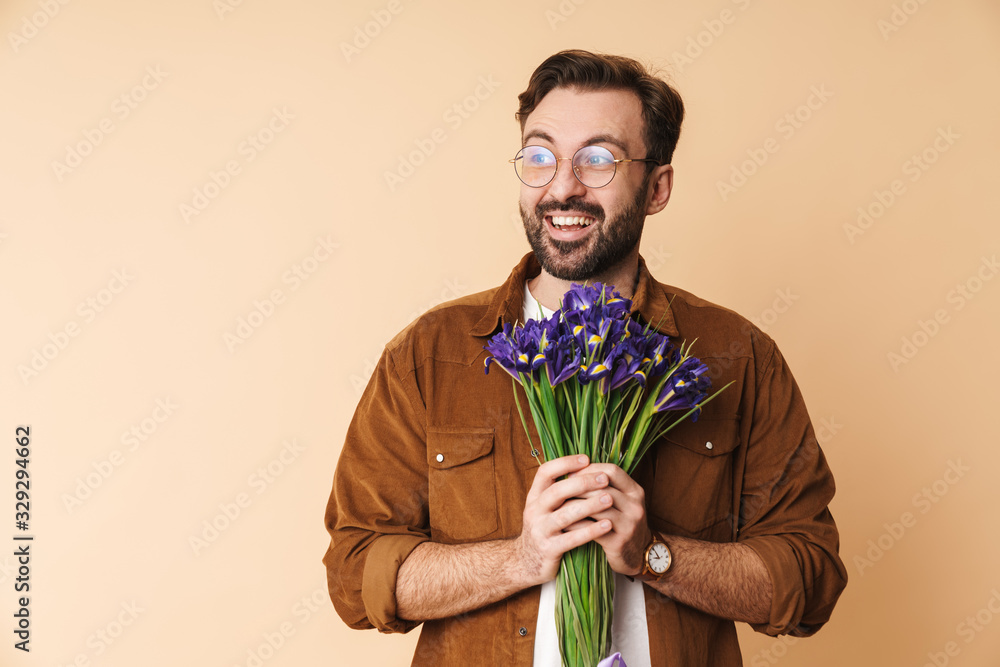Portrait of a cheerful young arttractive bearded man