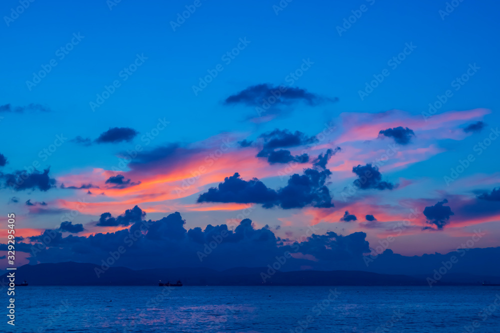 Glimpses of sunset on clouds in summer at night on the Black Sea in Gelendzhik Glimpses of sunset on clouds in summer at night on the Black Sea in Gelendzhik