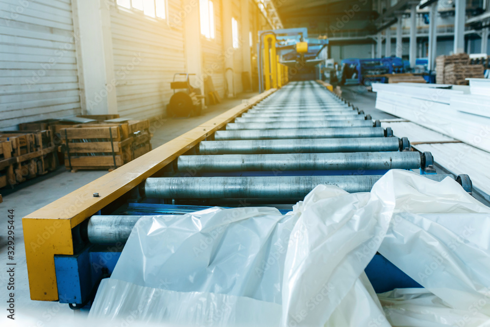 Fotografie Metal sheet roof rolled from rolling machine