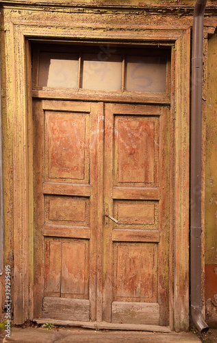 Closed vintage wooden door in old building