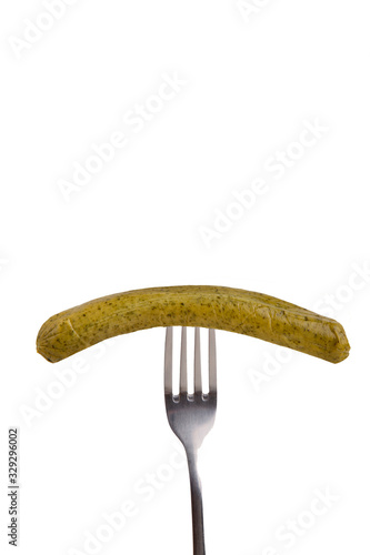 Sausage on fork. Organic protein sources on white background