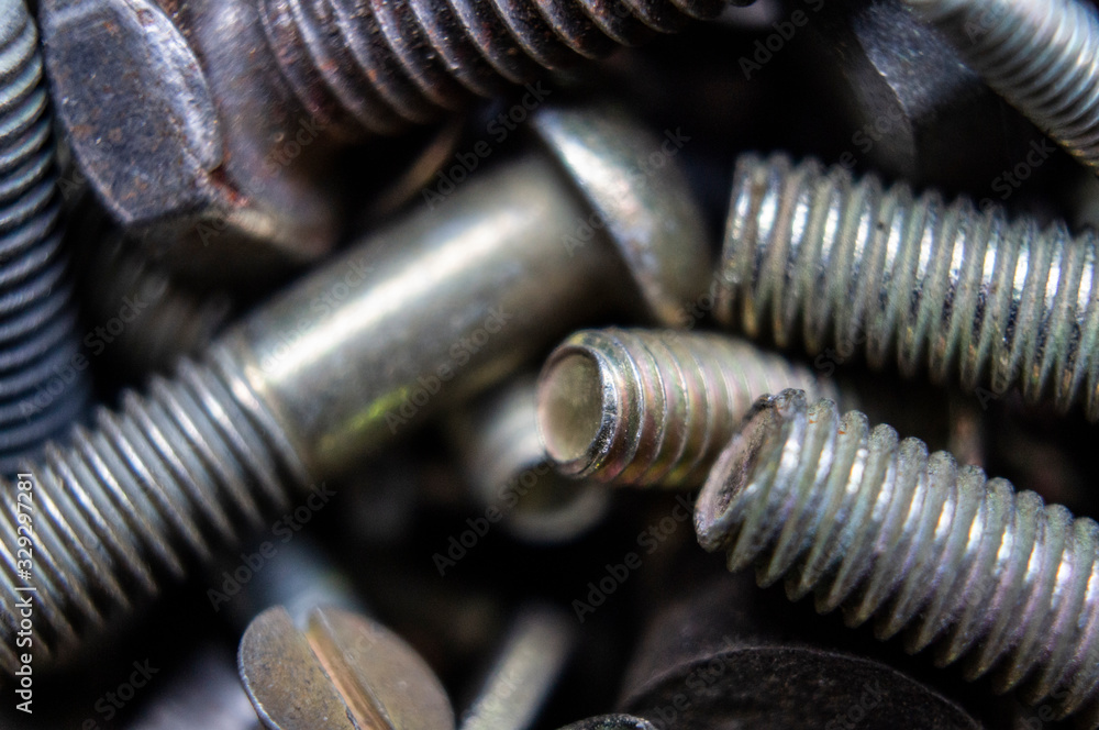 Metal hardware bolts and nails close-up. Macro photography Metal hardware bolts and nails close-up. Macro photography