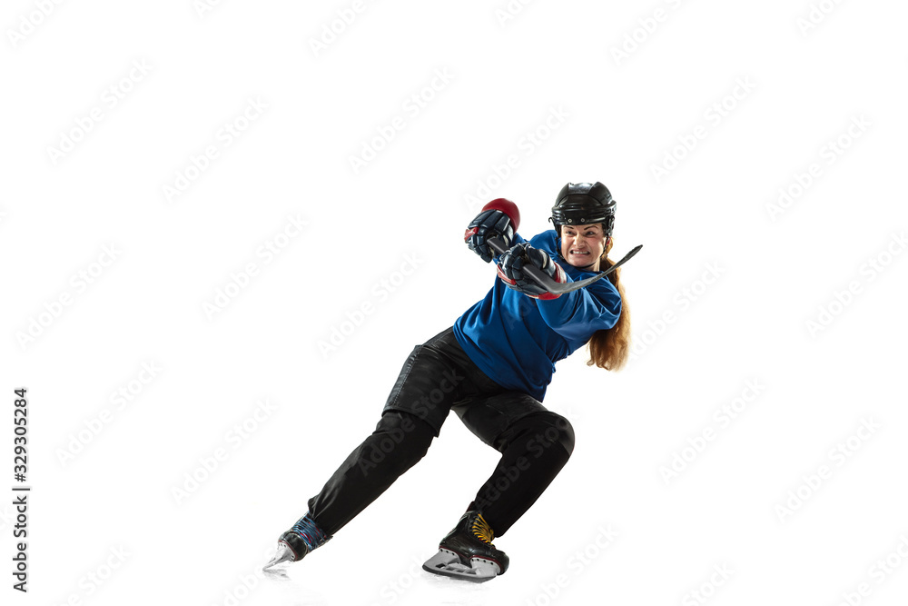 Young female hockey player with the stick on ice court and white background. Sportswoman wearing equipment and helmet training. Concept of sport, healthy lifestyle, motion, action, human emotions. Young female hockey player with the stick on ice court and white background. Sportswoman wearing equipment and helmet training. Concept of sport, healthy lifestyle, motion, action, human emotions.
