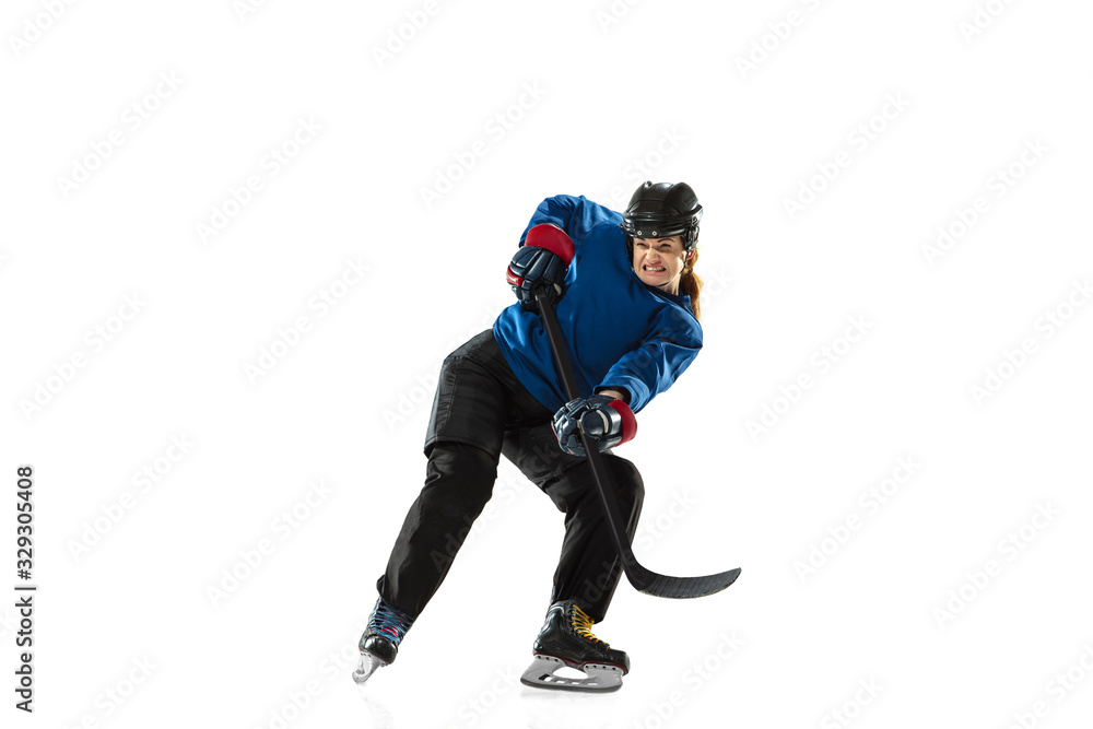 Young female hockey player with the stick on ice court and white background. Sportswoman wearing equipment and helmet training. Concept of sport, healthy lifestyle, motion, action, human emotions. Young female hockey player with the stick on ice court and white background. Sportswoman wearing equipment and helmet training. Concept of sport, healthy lifestyle, motion, action, human emotions.