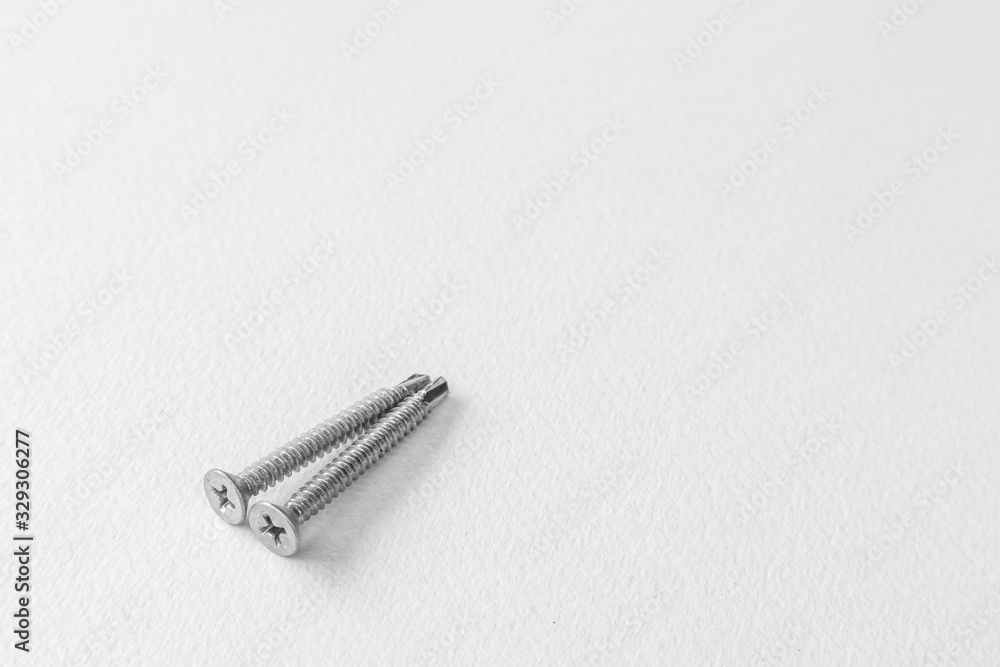Metal screws on white background. Metal screws on white background.