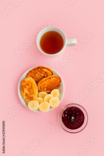 Pancakes with berries on a bright pastel background, copy space.