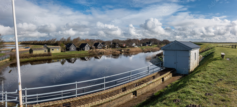 Obraz premium Small cottages behind the lockers in Sneum, Esbjerg Denmark