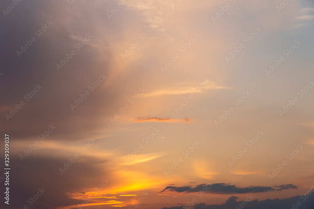 evening sky with clouds beautifully illuminated by the setting sun as a natural background