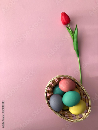 Template greeting card, copy Space for the holiday Easter eggs colorful on a pink background